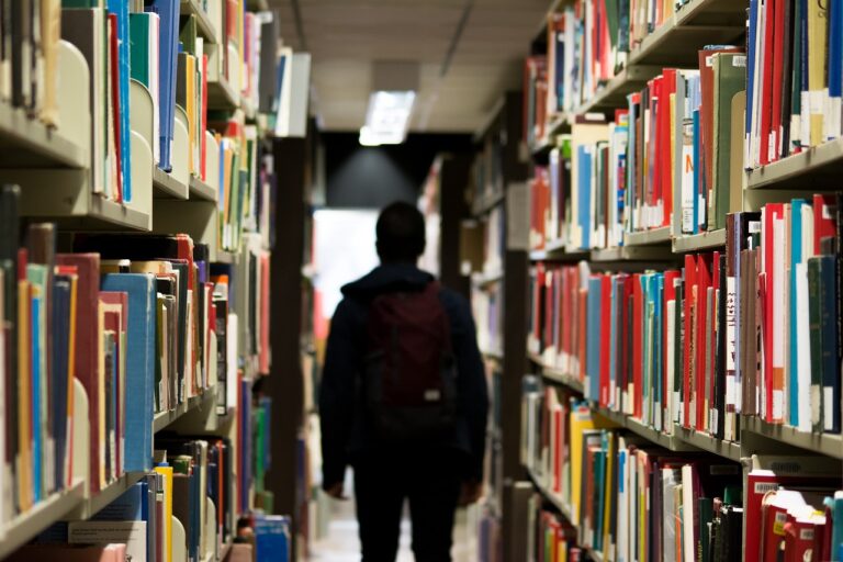 Student walking in library