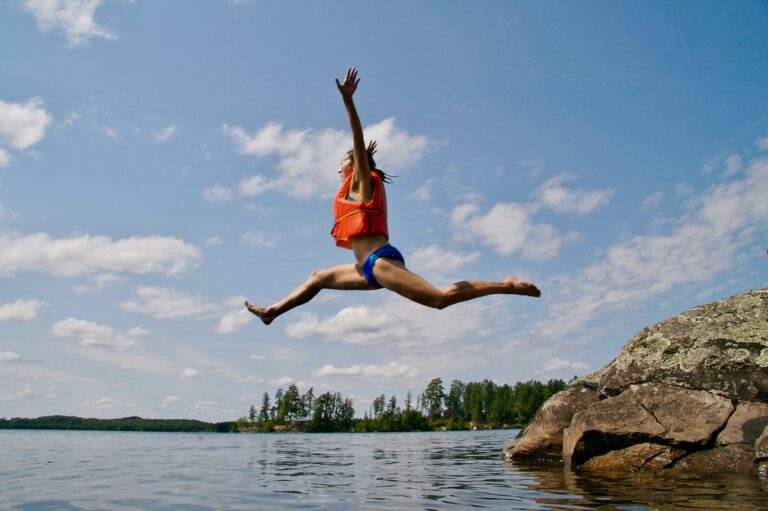 Kid jumping in water