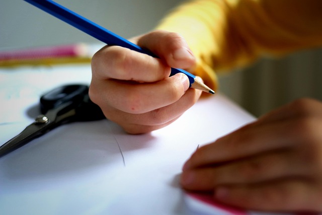 A student writing on paper